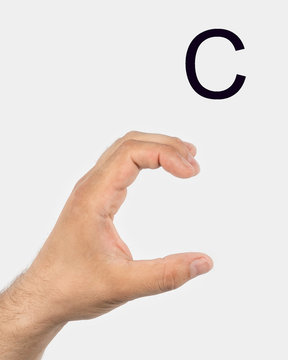Alphabet in Russian sign language.  A symbol 19 from 33. A man's hand on a light background.