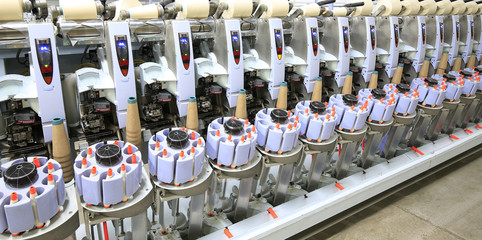 The modern spinning machine works in the workshop