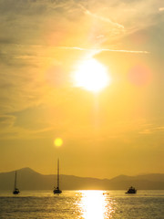 Scenic harbor of Sestri Levante at sunset with its famous Bay of Silence and its boats. Province of Genoa in Liguria, Italy.vertical