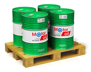 Group of barrels with motor oil lubricant on shipping pallet isolated on white