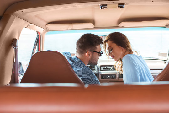 Beautiful Young Couple Going To Kiss In Car