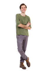 Full length casual man smiling and standing with arms crossed