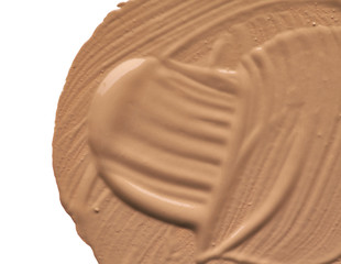Light beige makeup smear of creamy foundation
