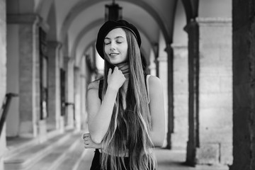 Obraz premium A charming girl with long and straight hair closed her eyes agai