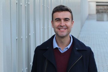 Handsome businessman smiling with copy space