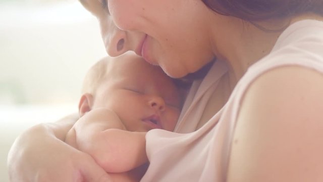 Happy mother and her newborn baby. Slow motion. 3840X2160 4K UHD video footage