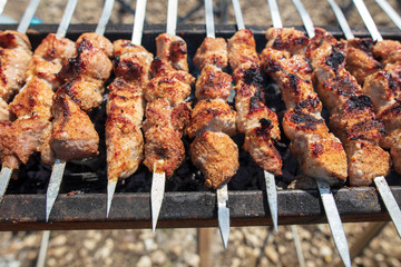 The meat is fried on sticks on charcoal