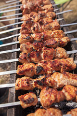 The meat is fried on sticks on charcoal