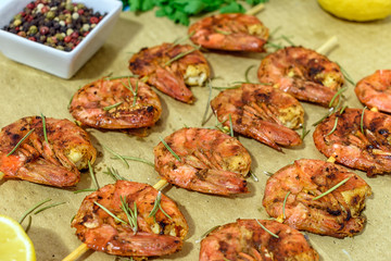 Fried prawns with fresh rosemary. Close-up.