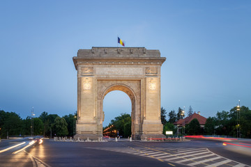 Fototapeta na wymiar Bucharest, The Triumphal Arch (Arcul de Triumf) at dusk