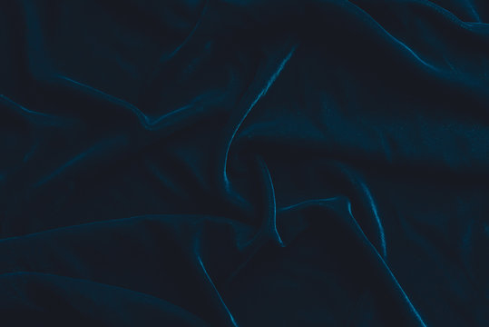 Luxurious dark blue velvet fabric background