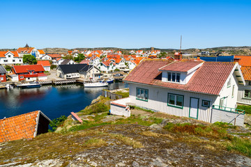 Fototapeta na wymiar View over the coastal village of Kladesholmen outside the island Tjorn on the Swedish west coast. A warm and sunny day by the sea.