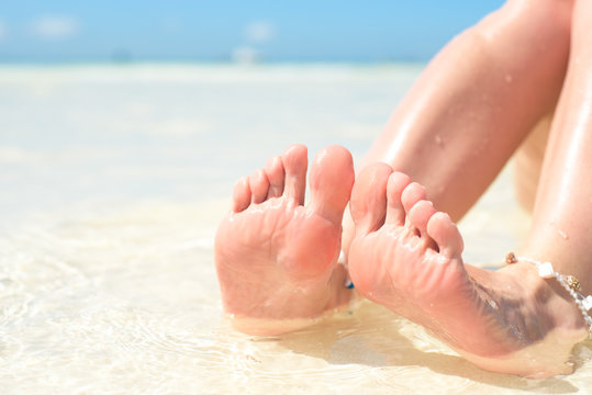 feet, sole of feet against the sea Pedicure and foot Spa .Care for the heels and soles of the feet. Foot massage.