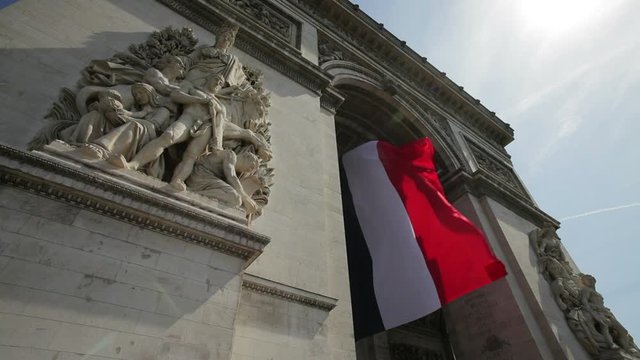  French flag under Arc de Triomphe built by Napoleon, Etiole, Paris, France, Europe