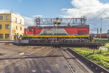 Fototapeta na wymiar electric freight locomotive on the turntable at the depot