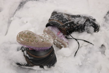 Children's shoes in the snow