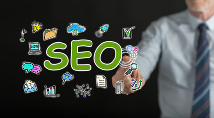 Man touching a seo concept on a touch screen