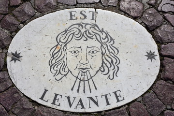 Rome. Granite plate with indication of the names of the winds, located on the floor of the Piazza of San Pietro in the Vatican.