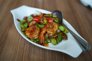 Stir-Fried Twisted cluster bean (Bitter bean or Stink bean) with shrimps paste, Traditional Thai food recipe, Popular in Thailand. 