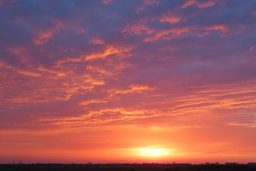 Fototapeta na wymiar Beautiful purple orange sunset background over the city 