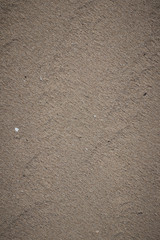 Closeup of sand pattern of a beach .
