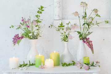 white vintage interior with flowers and candles