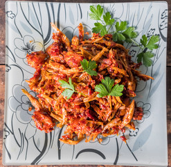 Malay dish stir fried chili with deep fried anchovies and potato cubes or locally known as ikan...