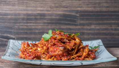 Malay dish stir fried chili with deep fried anchovies and potato cubes or locally known as ikan...