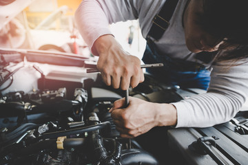 Young Asian car mechanic auto repair service provider.