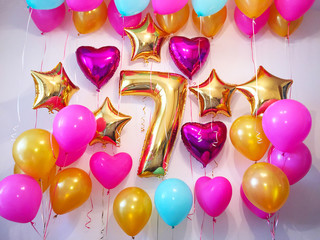 Birthday girl, 7 years old! Decorated the room with balloons of pink, fuchsia, gold and aquamarine colors
