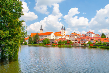 Fototapeta na wymiar Panoramic view of Telc with reflection in Stepnicky pond, Czech Republic. UNESCO World Heritage Site.