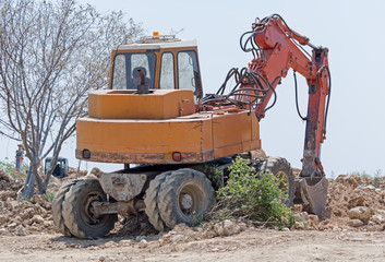 modern excavator performs excavation work