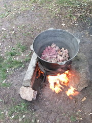 a large cauldron at the stake
