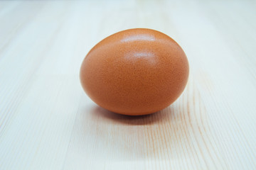 Chicken eggs on wooden table,