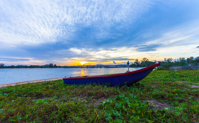 Fototapeta premium sunrise above Sarasin bridge fishing boats are parking on the beach