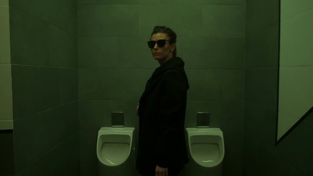 Girl is walking among pissoirs