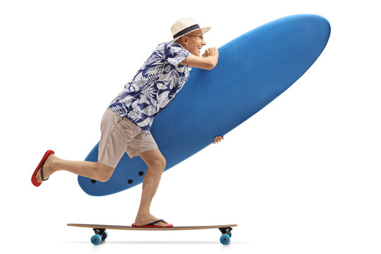 Elderly tourist with a surfboard riding a longboard