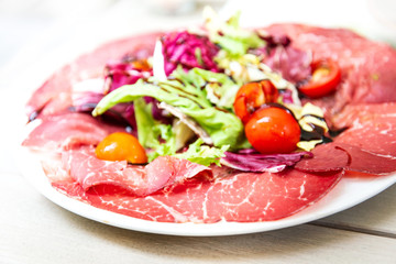 close up of tasty cold meats on the table
