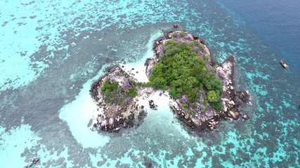 Bird’s eye view of tropical beach with crystal clear turquoise water on 'Koh Kra' island, Koh Lipe,Thailand