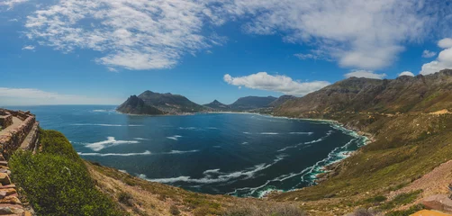 Fotobehang Panorama of Hout Bay in Cape Town with blue sky © bradleyvdw