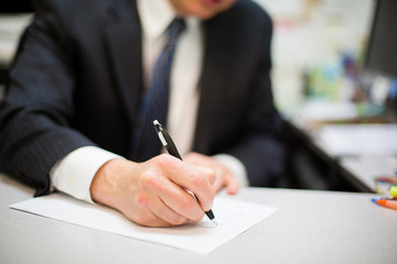 Businessman Signing Document