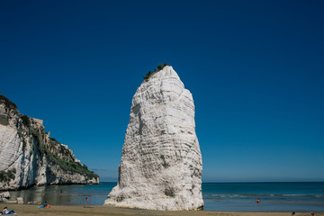 Fototapeta na wymiar White Rocks and blue sea vieste apulia in Italy