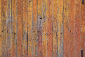 Very old scratched fence of brown or yellow color