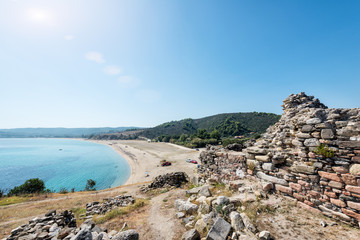 Fototapeta na wymiar Historical ruins of the castle on the beach of Sithonia. Greece