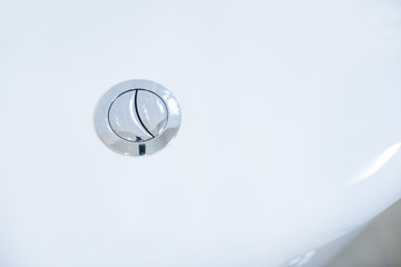 Close up of flush toilet button