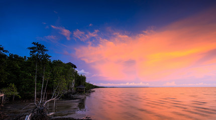 Fototapeta na wymiar Colorful sunset on the sea in black beach, Trat province, Thailand.