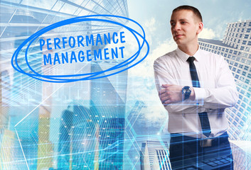 The concept of business, technology, the Internet and the network. Young businessman showing inscription: Performance management