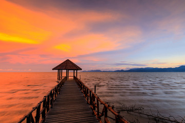 Colorful sunset on the sea in black beach, Trat province, Thailand.