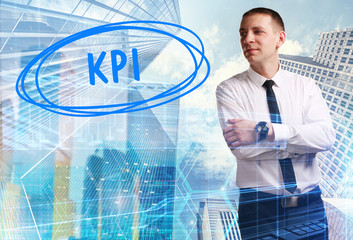 The concept of business, technology, the Internet and the network. Young businessman showing inscription: KPI