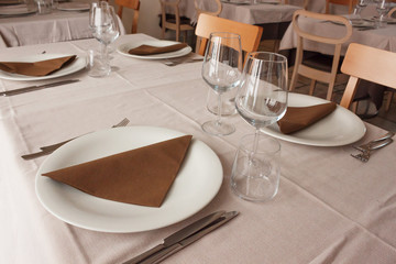 Served table in empty restaurant